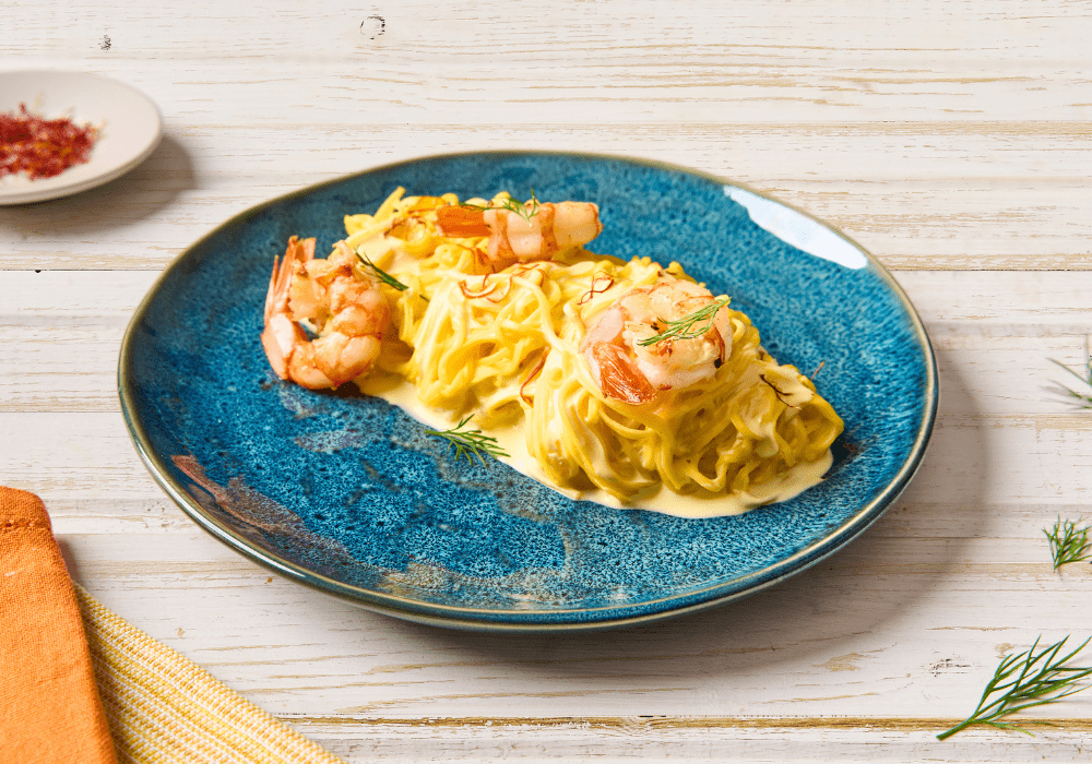 Tagliolini con crema allo zafferano e gamberi arrostiti